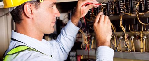 electrician working on a panel